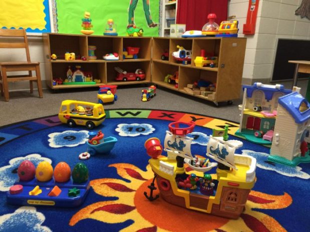 Age-appropriate toys and activities fill the classroom.